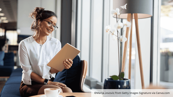 woman reading about institutions on tablet