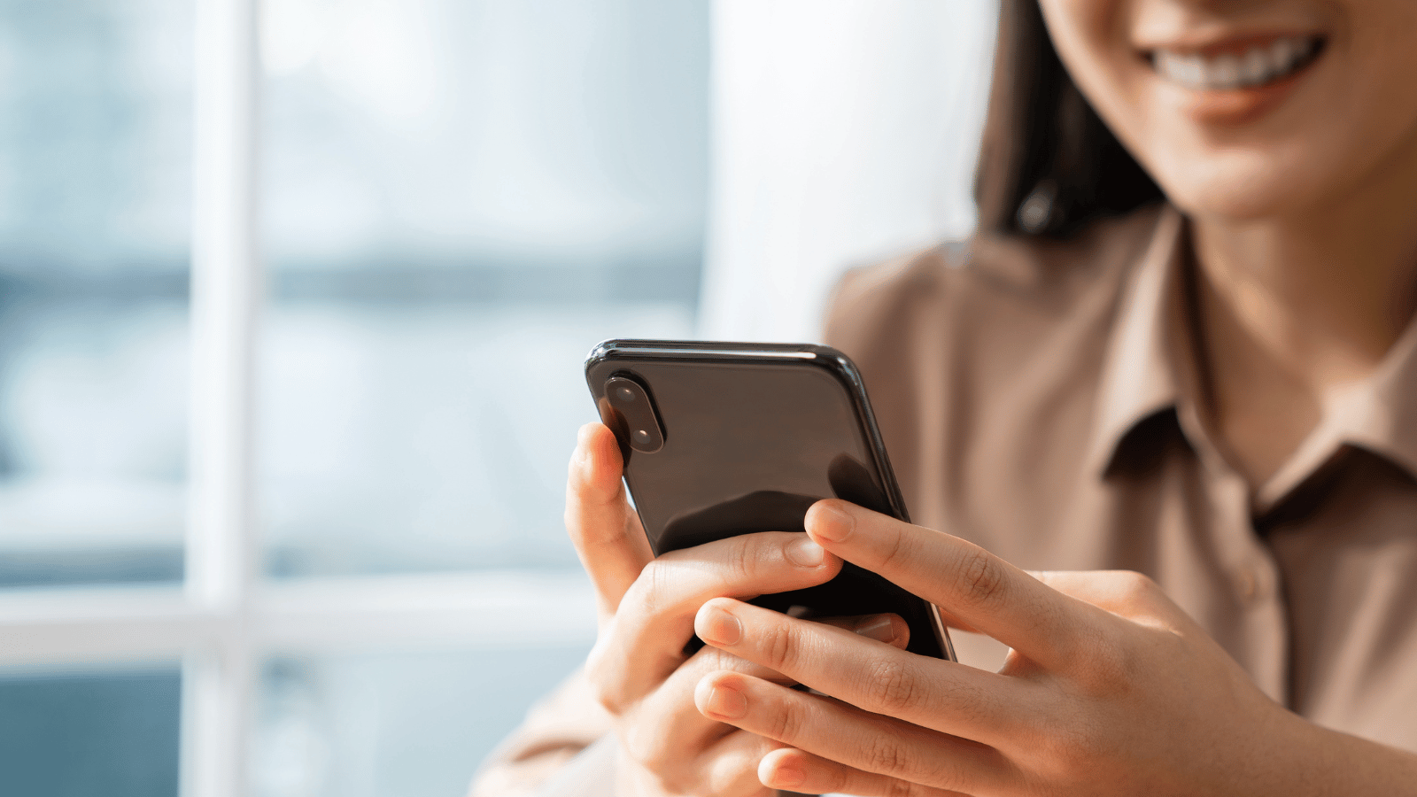 sharing on social media - woman with phone