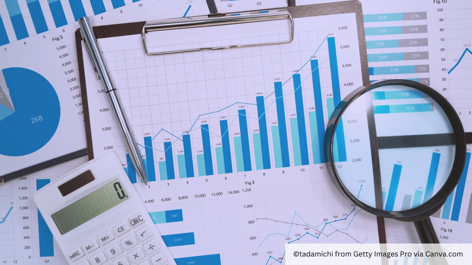 charts of competitor analysis with magnifying glass