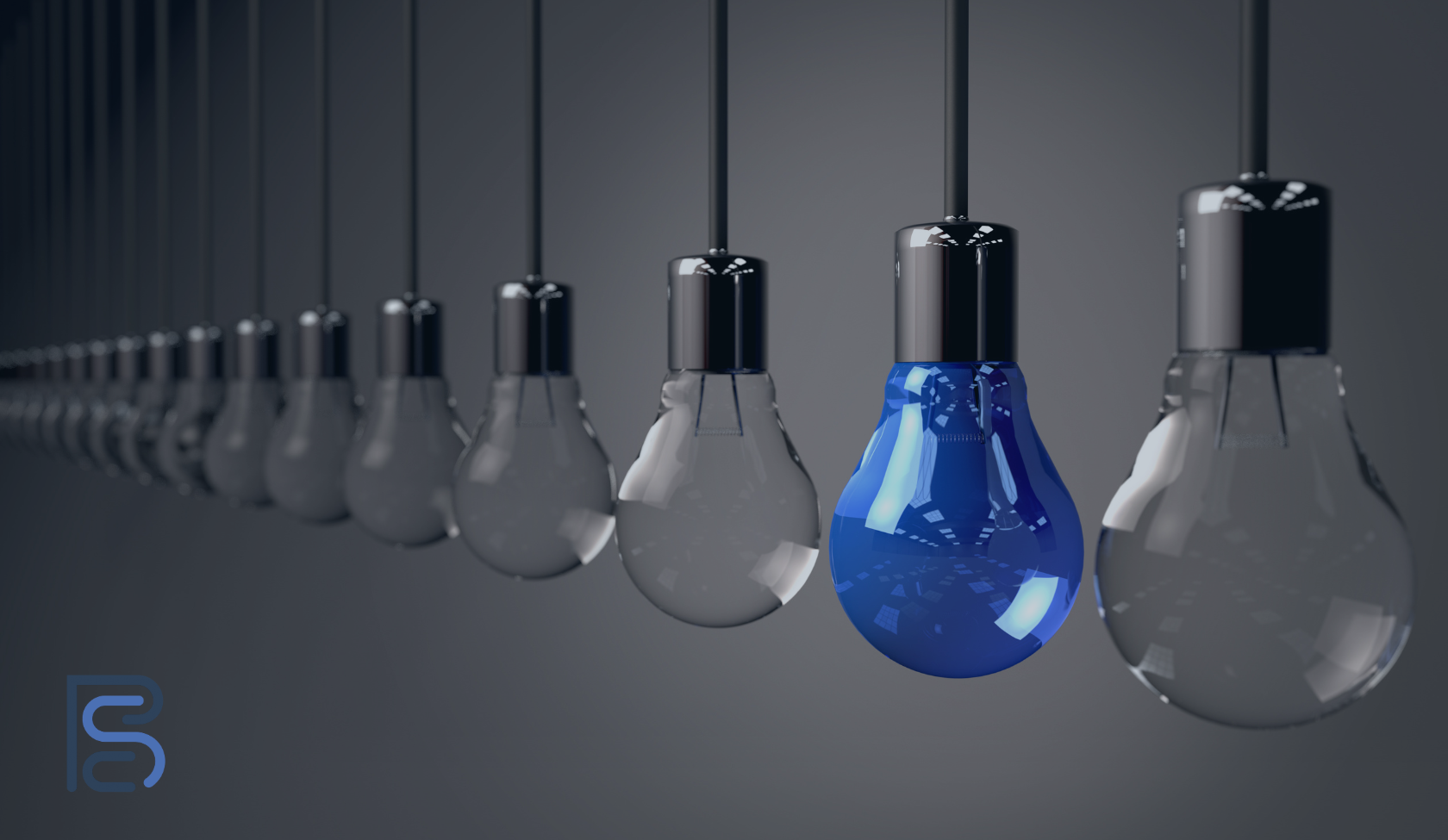 row of clear light bulbs with one blue one