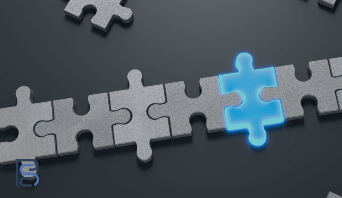 jigsaw pieces fitting together with one highlighted in glowing blue