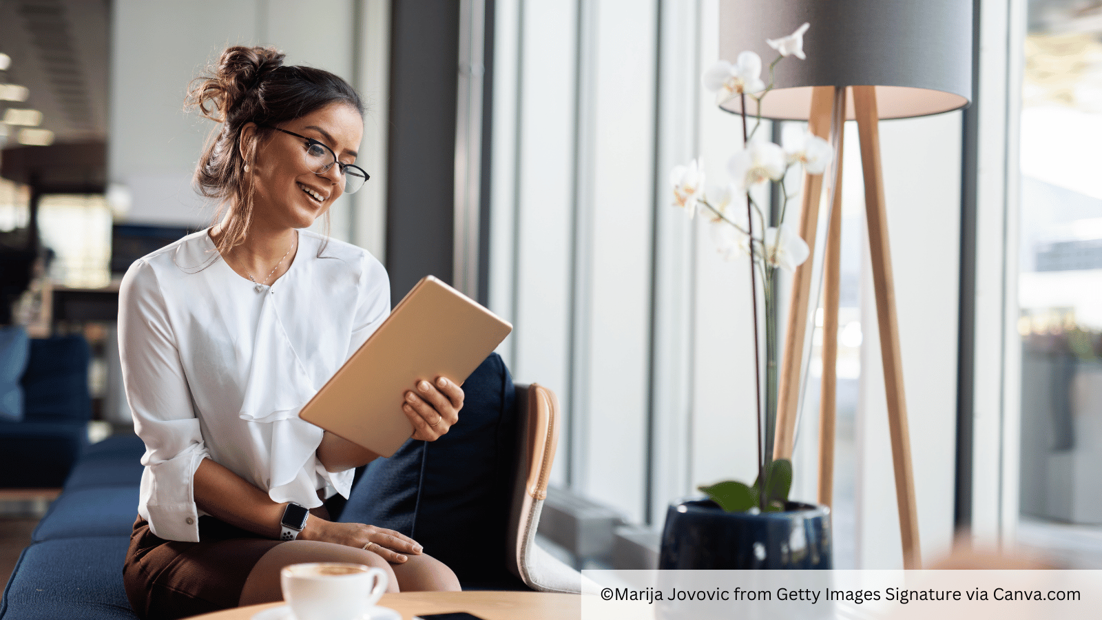 woman reading about institutions on tablet