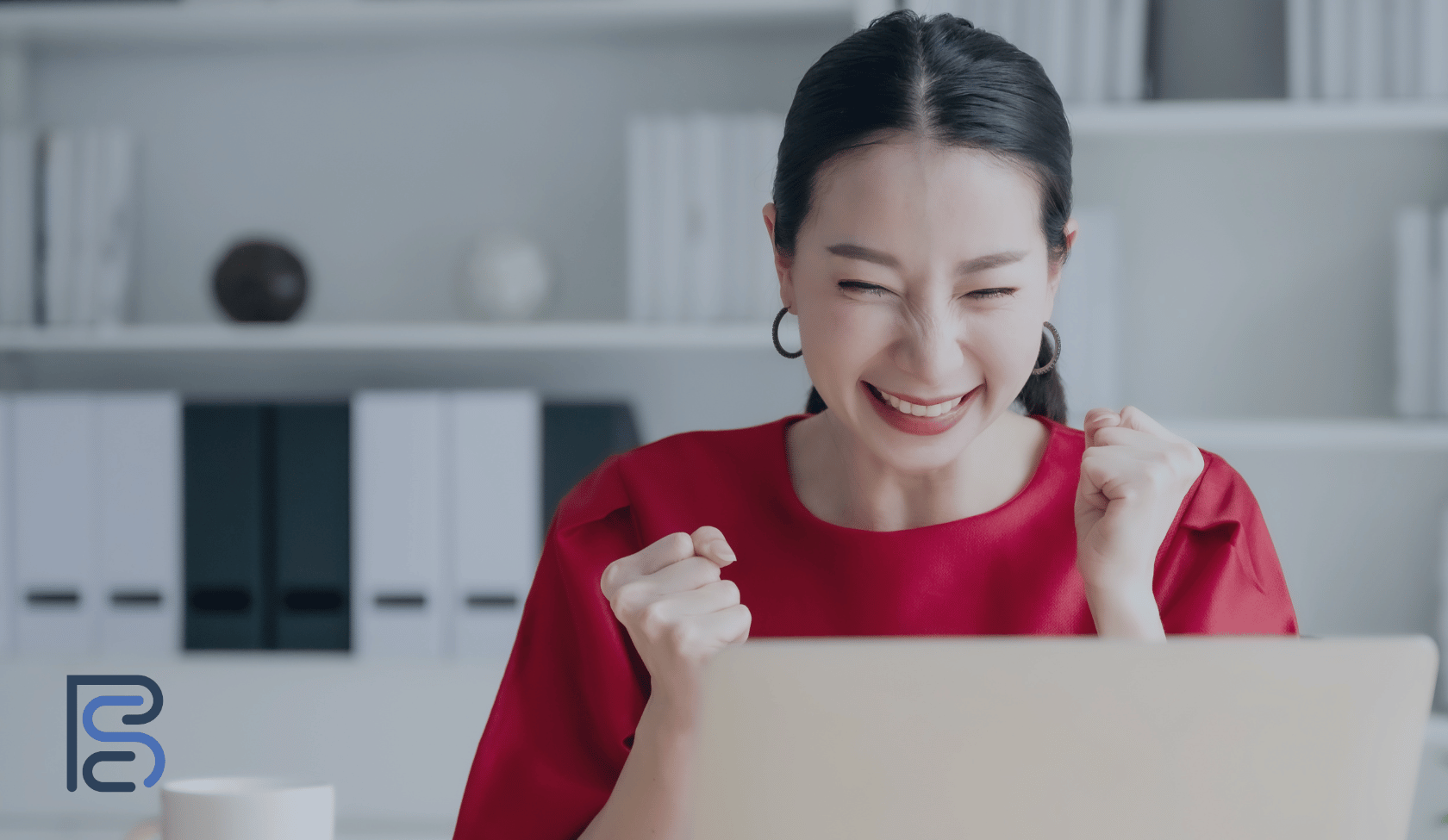 woman looking very happy at computer